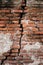 Background of old vintage dirty broken brick wall with peeling plaster, texture