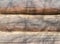 background from old wooden logs. wall of an old residential wooden rural house.