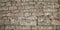 Background panorama old gray wall small rectangular natural stones