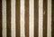 Background with parallel white and brown stripes