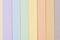 Background of pastel colors paper , parallel vertical stripes