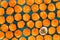 Background pattern of glazed orange cupcakes