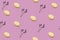 Background pattern of lavender and bath bomb in shell shape on a lilac background