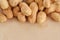 Background with peanuts unpeeled closed up