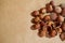 Background of peeled hazelnut kernels and shells and whole nuts