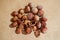 Background of peeled hazelnut kernels and shells and whole nuts