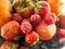 Background persimmons, plums, raspberry, strawberries. Harvest. Health organic food. Color texture, photo