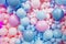 background. Photo zone for a gender party made of pink and blue balloons