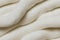 Background picture of soft fur white gray carpet. Top view of fake fur fabric wool sheep fleece closeup texture