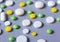 Background from pills. Round pills of different colors and one oval  pill. Pharmaceutical concept.