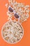 Background. Popcorn, cup and 3d glasses on a colored orange background. Flat lay