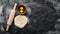 Background of the preparation of flour dough. rolling pin and flour on a black background.