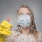 Background of purity, focusing on glass. The girl washes the mask actively, disinfecting everything from viruses, bacteria and