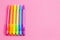 Background with Rainbow Mechanical Pencils on a Bright Pink Table Great for Back to School