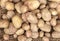 Background of raw potatoes for sale in the grocery