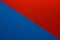 Background of red and blue paper divided diagonally. Sheets of blank blue and red paper with fine texture, close up