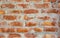 Background of red and brown color textured brick wall.
