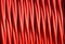 Background of red electric cable insulating rubber
