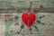 Background with red heart and antique keys on old painted wooden