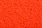 Background of red orange seed beads.