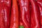 Background of red peppers lying tightly