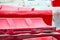 Background of red and white plastic traffic barriers