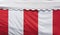 Background of red and white striped canvas awning and white roof tent with sunlight on surface