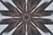 Background from a repeating kaleidoscope view with gray dark and bright lines and shapes coming from the center