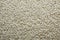 Background of rice. Rice texture. Rice grains closeup. Top view