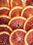 Background of ripe juicy slices of blood orange. Vertical