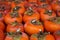 Background of ripe persimmons. Persimmon fruits are sold in the market. Persimmon is a delicious and healthy fruit. Fig persimmon