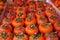 Background of ripe persimmons. Persimmon fruits are sold in the market. Persimmon is a delicious and healthy fruit. Fig persimmon