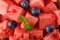 Background of ripe pieces of watermelon with blueberries