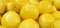 Background of ripe yellow lemons, tasty, unusual fruit background