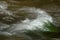 Background in the river running water through a rocky area