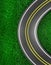 Background of a road or highway cornering on a green grass