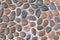 Background of round pebbles in cement.Stones texture and wallpaper.Wash concrate covering textured floor and pattern. Close up