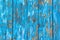 Background of rustic planks with blue paint peel off