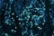 Background sequin. Holiday abstract glitter Fashion fabric with blue blinking lights. Sequins in bright colors