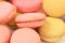 Background of several various macaron cakes.