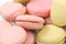 Background of several various macaroons cakes