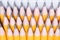 Background of sharpened simple pencils lying together, close-up