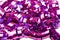Background of shiny purple color streamers holiday