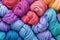 Background of skeins of colored yarn seen from above. Many skein yarns in colorful rainbow.