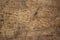 Background of a solid untreated board. The timber has a pronounced woody texture. Old floor board close-up. Texture