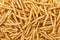 Background of stack of crispy french fries, directly above.