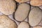 Background stone smooth pebbles light beige part wall close-up base geology substrate eco