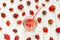 Background from strawberry water and fresh berries on a white table. Summer drink