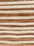 Background from a striped knitted fabric biege