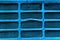 Background surface of blue and damaged metallic grid